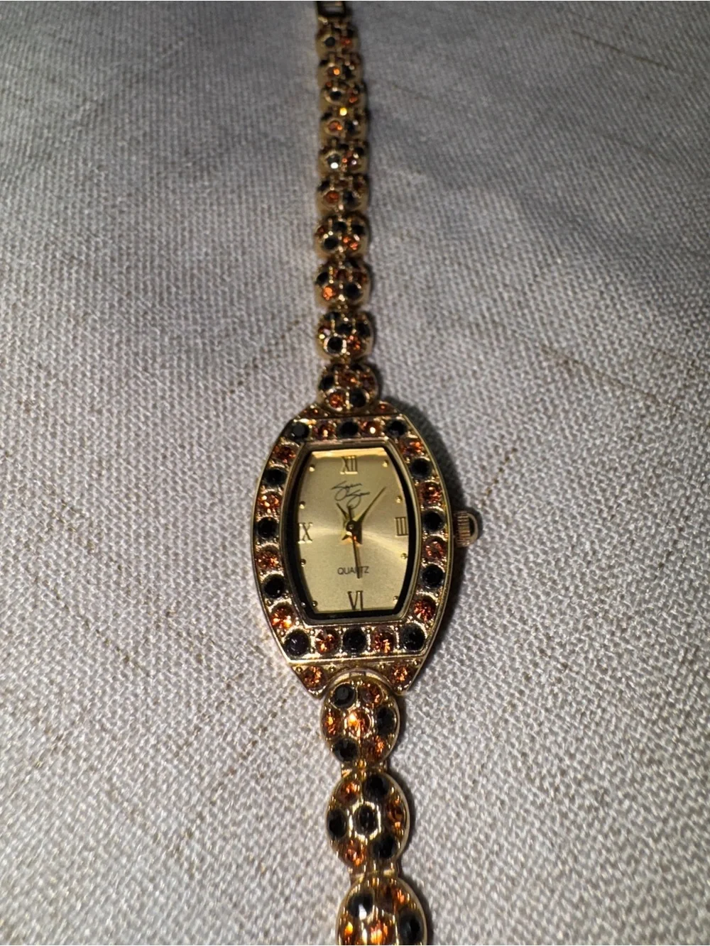 Gold-Tone Garnet Accent Womens Bracelet Watch